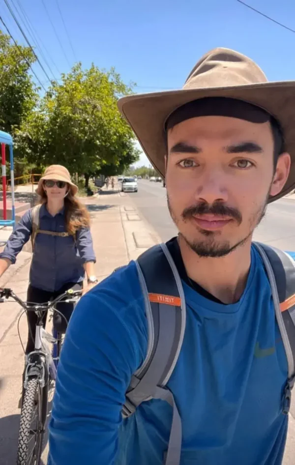 Tourists cycling from Maipu Bikes to wineries along the Maipú Wine Route in Mendoza, Argentina.